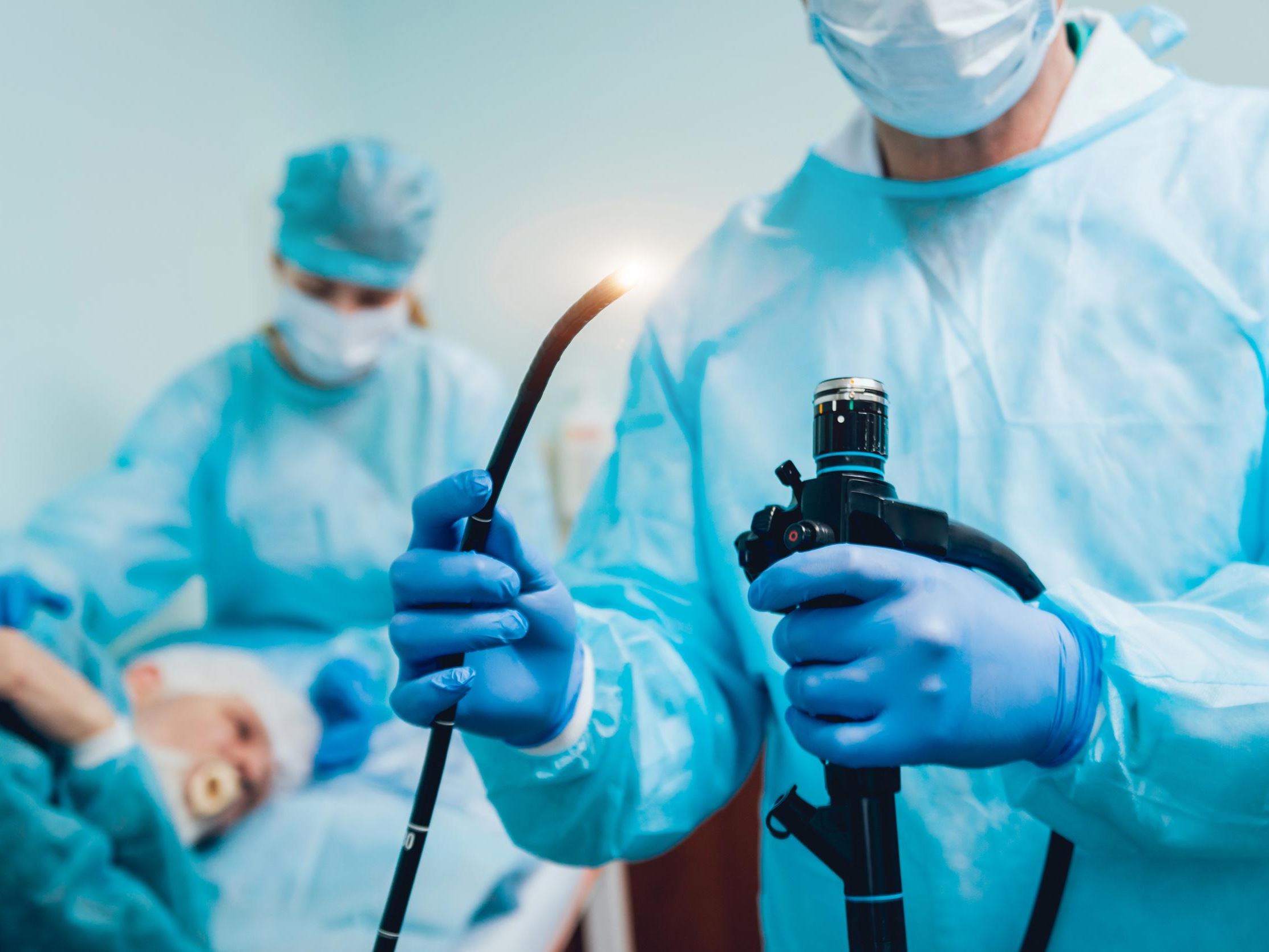 Doctor holding endoscope before gastroscopy